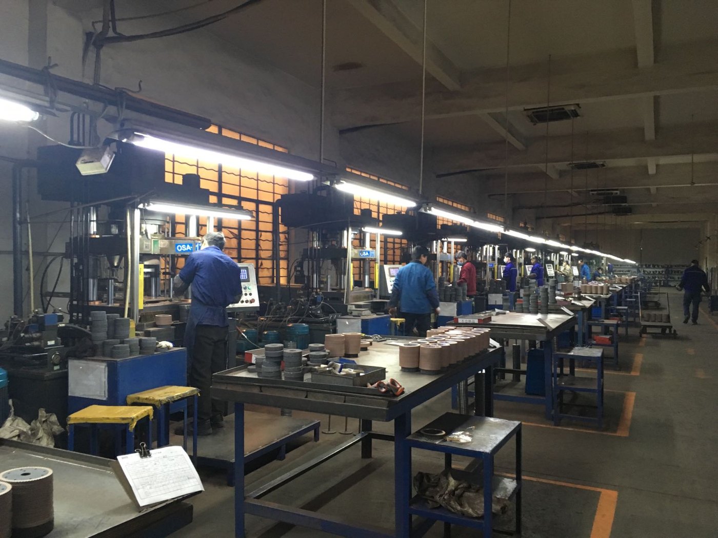 Cold-press line with operators forming diamond segments, Hangzhou plant